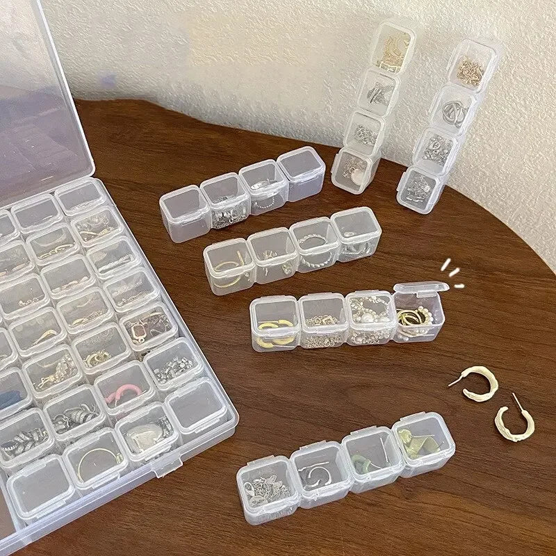 Boîte de rangement de bijoux en plastique à 28 grilles