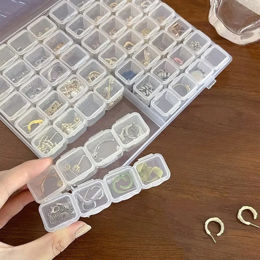 Boîte de rangement de bijoux en plastique à 28 grilles
