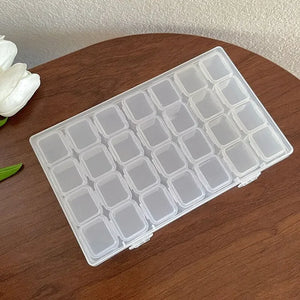 Boîte de rangement de bijoux en plastique à 28 grilles