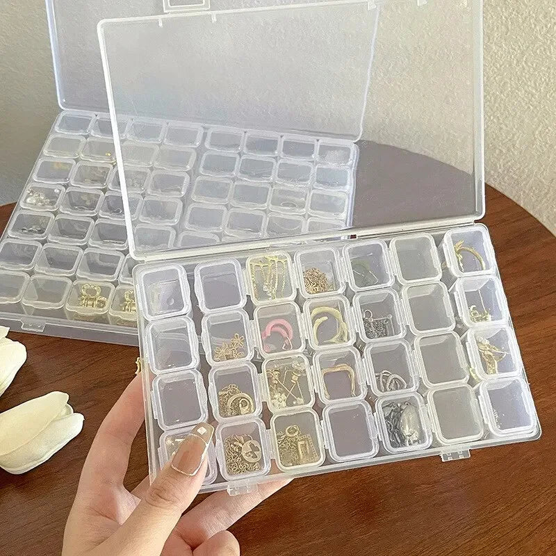 Boîte de rangement de bijoux en plastique à 28 grilles